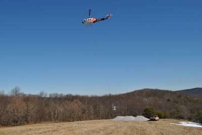 Photo of Helicopter picking up limestone at St. Mary's Project in Virginia